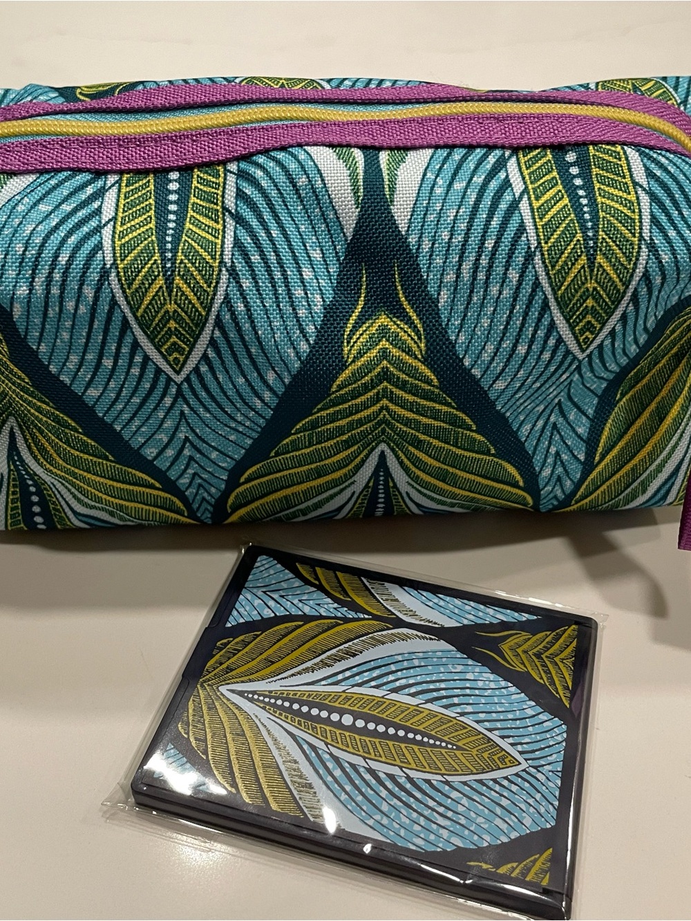 Estée Lauder Blue & Green Leaf-Print Cosmetic Pouch with matching pocket mirror.